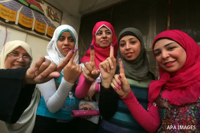 Egyptian women show thier ink-marked finger after casting thier ballot during the first round of Egypt's presidential elections, at a polling station in Cairo, Egypt, 24 May 2012. for the first Presidential election sinc...