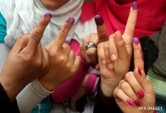 Egyptian women show thier ink-marked finger after casting thier ballot during the first round of Egypt's presidential elections, at a polling station in Cairo, Egypt, 24 May 2012. for the first Presidential election sinc...