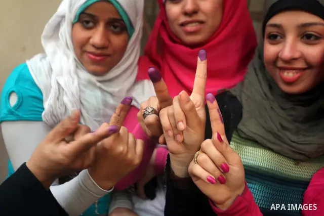 Egyptian women show thier ink-marked finger after casting thier ballot during the first round of Egypt's presidential elections, at a polling station in Cairo, Egypt, 24 May 2012. for the first Presidential election sinc...