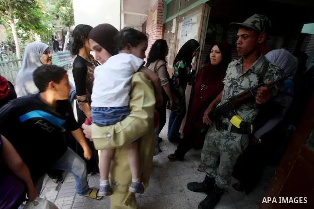 Voters wait outside a polling station in Cairo during presidential elections May 24, 2012. Egypt resumes its first free presidential election on Thursday after voting passed off mostly calmly on the first day apart from...