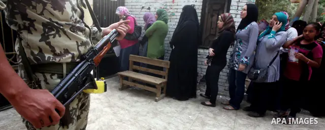 Voters wait outside a polling station in Cairo during presidential elections May 24, 2012. Egypt resumes its first free presidential election on Thursday after voting passed off mostly calmly on the first day apart from...
