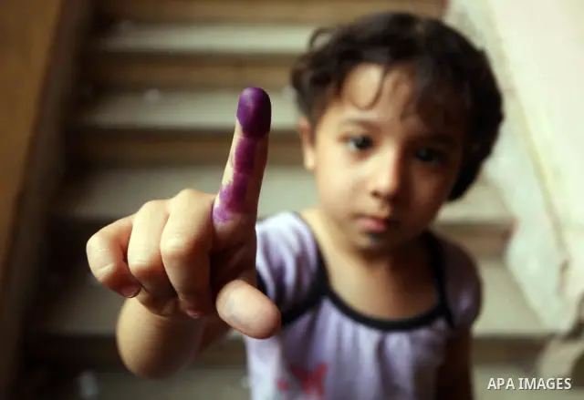 An Egyptian kid shows his finger during the first round of Egypt's presidential elections, at a polling station in Cairo, Egypt, 24 May 2012. for the first Presidential election since the ouster of former president Hosni...
