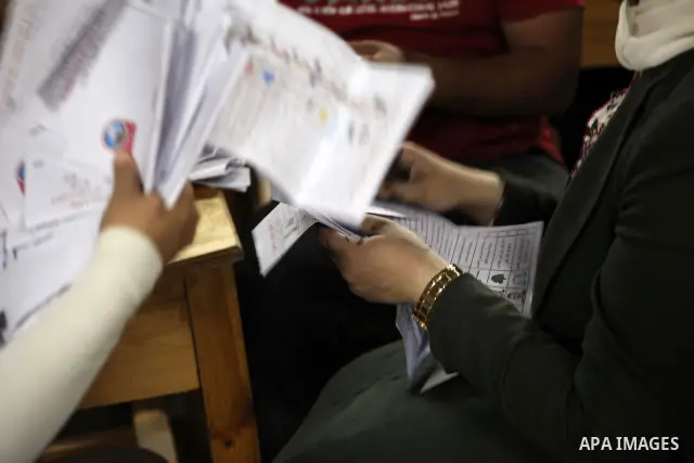 Egyptian election officials count ballots of the first round of Egypt's presidential elections, in a polling station in Cairo, Egypt, at the end of the election's second day on 24 May 2012. Polling stations closed at 9 p...