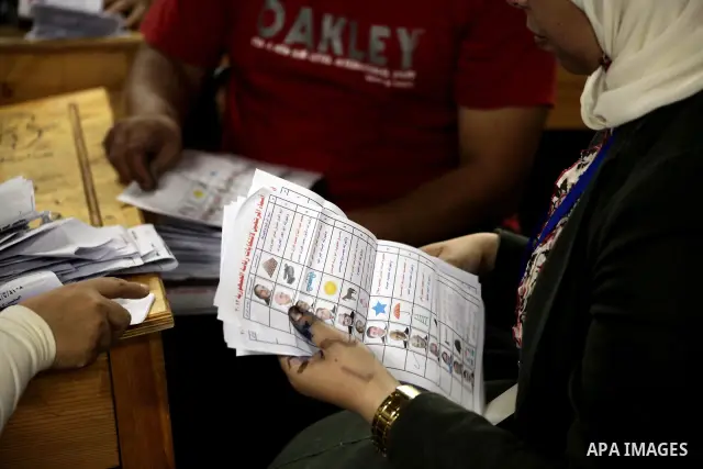 Egyptian election officials count ballots of the first round of Egypt's presidential elections, in a polling station in Cairo, Egypt, at the end of the election's second day on 24 May 2012. Polling stations closed at 9 p...