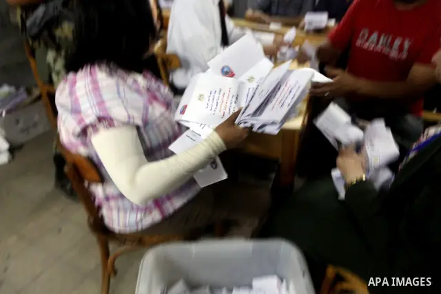 Egyptian election officials count ballots of the first round of Egypt's presidential elections, in a polling station in Cairo, Egypt, at the end of the election's second day on 24 May 2012. Polling stations closed at 9 p...