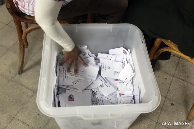 Egyptian election officials count ballots of the first round of Egypt's presidential elections, in a polling station in Cairo, Egypt, at the end of the election's second day on 24 May 2012. Polling stations closed at 9 p...