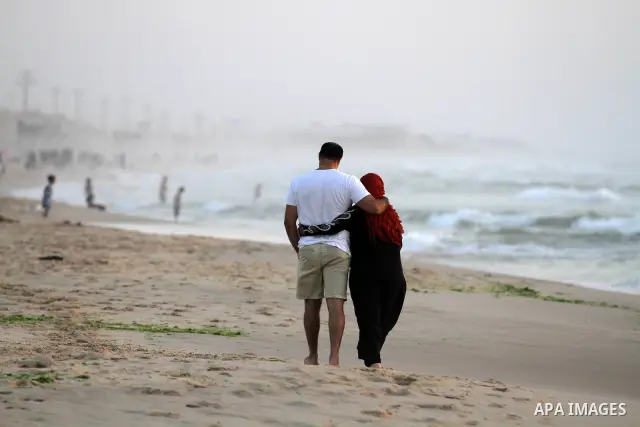 Palestinians enjoy at the beach in Gaza City on May 24, 2012. Gaza beach is the only outlet for the Palestinians after tightening the Israeli blockade on the Gaza Strip. Photo by Majdi Fathi