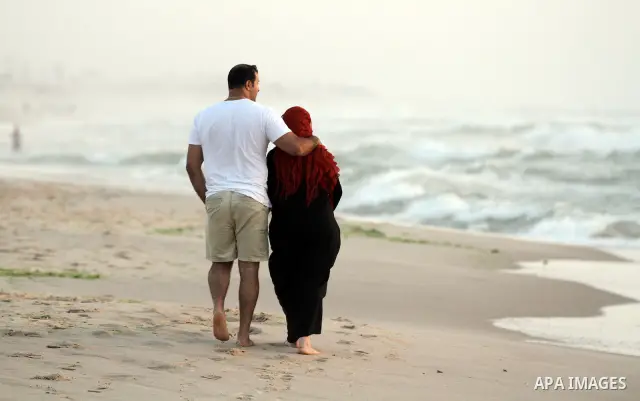 Palestinians enjoy at the beach in Gaza City on May 24, 2012. Gaza beach is the only outlet for the Palestinians after tightening the Israeli blockade on the Gaza Strip. Photo by Majdi Fathi