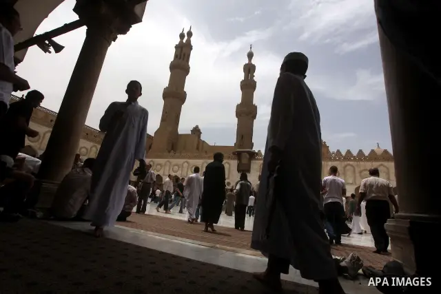 Egyptians attend friday prayers at Al Azhar Mosque in cairo city, 25 May 2012. Many residents and voters now wait in anticipation of the results. following the excitement of casting votes in Egypt's first legitimate demo...