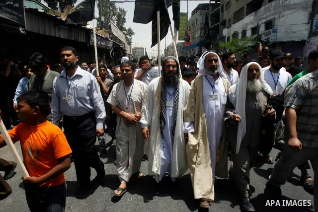 Palestinian Islamic Jihad members take part in a demonstration following friday prayers in solidarity with prisoners jailed in Israel after days from signing of a deal to end the prisoner's hunger strike, in Rafah refuge...