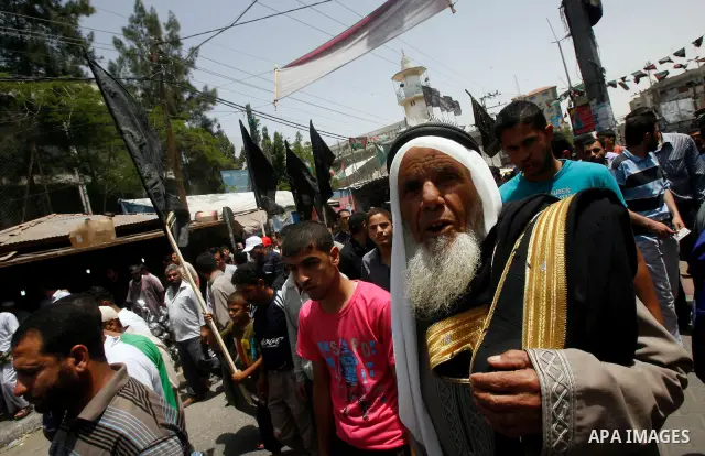 Palestinian Islamic Jihad members take part in a demonstration following friday prayers in solidarity with prisoners jailed in Israel after days from signing of a deal to end the prisoner's hunger strike, in Rafah refuge...
