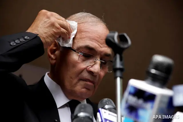 Egyptian presidential candidate Ahmed Shafiq speaks to the media during a press conference at his office in Cairo, Egypt, Saturday, May 26, 2012. Egyptian presidential candidate Ahmed Shafiq paid tribute Saturday to the...