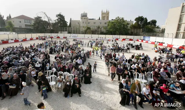 Palestinians participate a celebration in Arab east jerusalem after the longest buffet of natural and organic food registered a new Guinness world record. -- Palestinians serve food from the longest buffet table of natur...