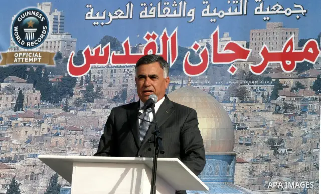 Palestinians participate a celebration in Arab east jerusalem after the longest buffet of natural and organic food registered a new Guinness world record. -- Palestinians serve food from the longest buffet table of natur...