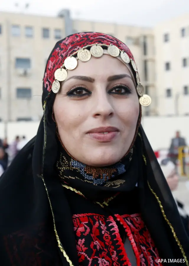 Palestinians participate a celebration in Arab east jerusalem after the longest buffet of natural and organic food registered a new Guinness world record. -- Palestinians serve food from the longest buffet table of natur...