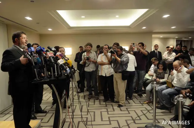 Muslim Brotherhood Egyptian presidential candidate Mohammed Mursi gives a press conference in Cairo on May 26, 2012. The Muslim Brotherhood today urged Egyptians to rally behind their presidential candidate in an almost...
