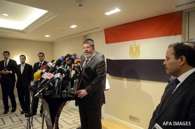 Muslim Brotherhood Egyptian presidential candidate Mohammed Mursi gives a press conference in Cairo on May 26, 2012. The Muslim Brotherhood today urged Egyptians to rally behind their presidential candidate in an almost...