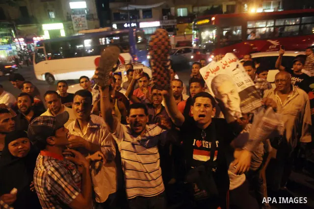 Egyptian protesters shout slogans during a protest against candidate Ahmed Shafiq and support candidate Hamdeen Sabahi, at Tahrir Square in Cairo May 27, 2012. The prospect of Shafiq succeeding Hosni Mubarak as president...