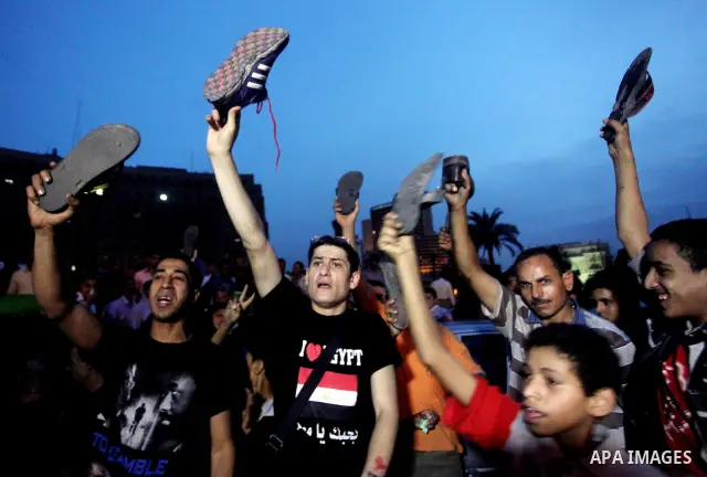 Egyptian protesters shout slogans during a protest against candidate Ahmed Shafiq and support candidate Hamdeen Sabahi, at Tahrir Square in Cairo May 27, 2012. The prospect of Shafiq succeeding Hosni Mubarak as president...