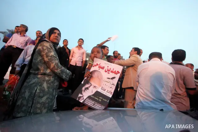 Egyptian protesters shout slogans during a protest against candidate Ahmed Shafiq and support candidate Hamdeen Sabahi, at Tahrir Square in Cairo May 27, 2012. The prospect of Shafiq succeeding Hosni Mubarak as president...