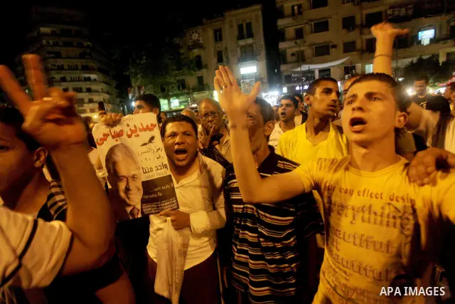 Egyptian protesters shout slogans during a protest against candidate Ahmed Shafiq and support candidate Hamdeen Sabahi, at Tahrir Square in Cairo May 27, 2012. The prospect of Shafiq succeeding Hosni Mubarak as president...