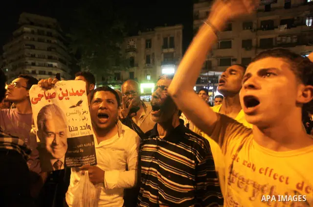 Egyptian protesters shout slogans during a protest against candidate Ahmed Shafiq and support candidate Hamdeen Sabahi, at Tahrir Square in Cairo May 27, 2012. The prospect of Shafiq succeeding Hosni Mubarak as president...