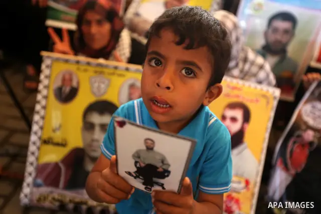 Relatives of Palestinian prisoners participate a protest at the Red Cross' offices in Gaza City to call for the release of Palestinian prisoners held in Israeli jails, on May. 28, 2012. Photo by Majdi Fathi