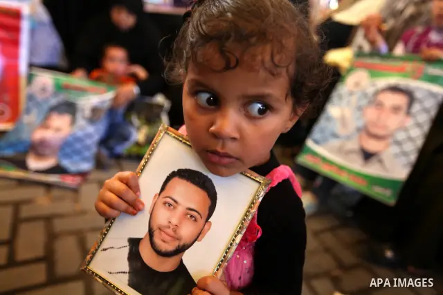 Relatives of Palestinian prisoners participate a protest at the Red Cross' offices in Gaza City to call for the release of Palestinian prisoners held in Israeli jails, on May. 28, 2012. Photo by Majdi Fathi