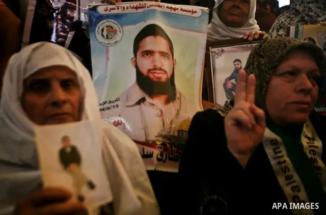 Relatives of Palestinian prisoners participate a protest at the Red Cross' offices in Gaza City to call for the release of Palestinian prisoners held in Israeli jails, on May. 28, 2012. Photo by Ali Jadallah