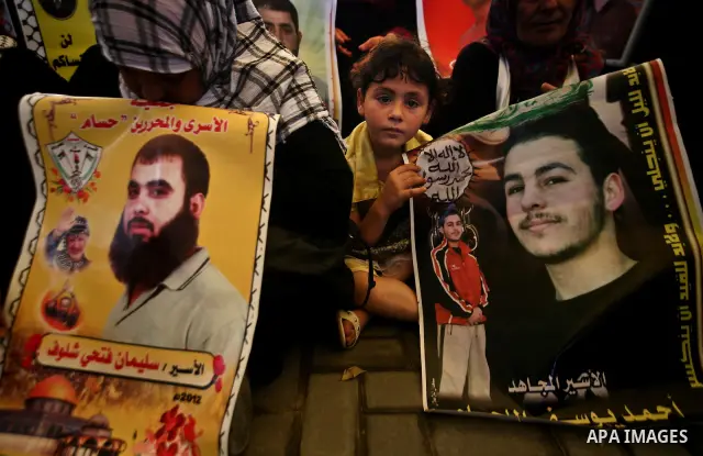 Relatives of Palestinian prisoners participate a protest at the Red Cross' offices in Gaza City to call for the release of Palestinian prisoners held in Israeli jails, on May. 28, 2012. Photo by Ali Jadallah