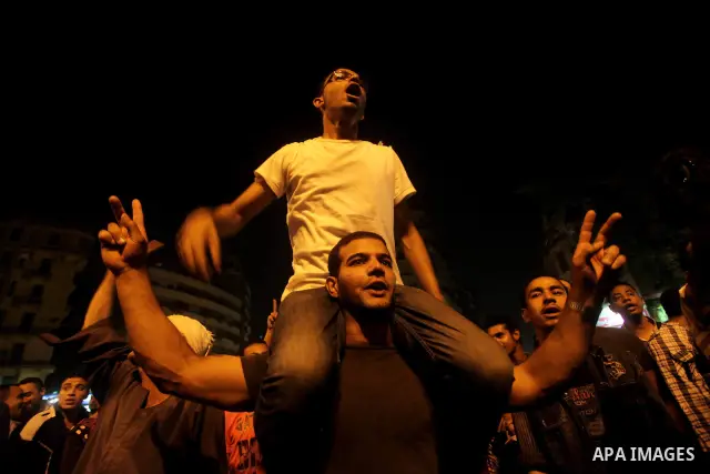 A youth takes part in a demonstration in Tahrir Square to protest the outcome of the Egyptian presidential election, Cairo, Egypt, Monday May 28, 2012. The runoff vote for Egypt's next president will pit the Muslim Broth...
