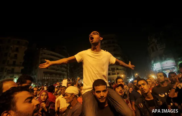 A youth takes part in a demonstration in Tahrir Square to protest the outcome of the Egyptian presidential election, Cairo, Egypt, Monday May 28, 2012. The runoff vote for Egypt's next president will pit the Muslim Broth...