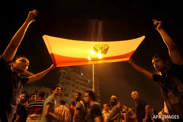 A youth takes part in a demonstration in Tahrir Square to protest the outcome of the Egyptian presidential election, Cairo, Egypt, Monday May 28, 2012. The runoff vote for Egypt's next president will pit the Muslim Broth...