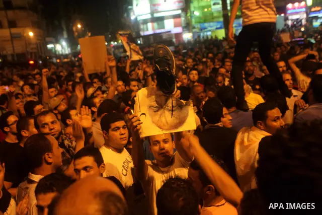 A youth takes part in a demonstration in Tahrir Square to protest the outcome of the Egyptian presidential election, Cairo, Egypt, Monday May 28, 2012. The runoff vote for Egypt's next president will pit the Muslim Broth...