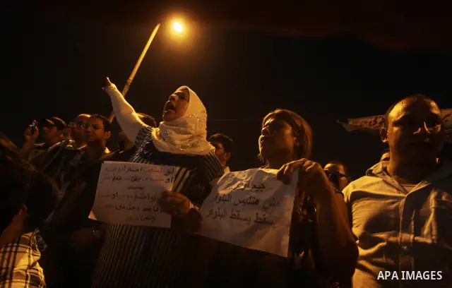 A youth takes part in a demonstration in Tahrir Square to protest the outcome of the Egyptian presidential election, Cairo, Egypt, Monday May 28, 2012. The runoff vote for Egypt's next president will pit the Muslim Broth...