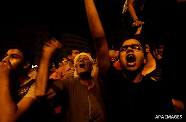 A youth takes part in a demonstration in Tahrir Square to protest the outcome of the Egyptian presidential election, Cairo, Egypt, Monday May 28, 2012. The runoff vote for Egypt's next president will pit the Muslim Broth...