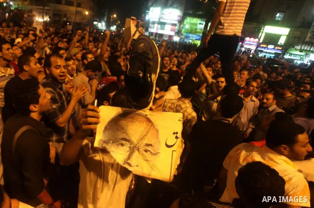 A youth takes part in a demonstration in Tahrir Square to protest the outcome of the Egyptian presidential election, Cairo, Egypt, Monday May 28, 2012. The runoff vote for Egypt's next president will pit the Muslim Broth...