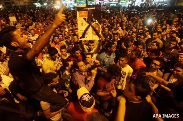 A youth takes part in a demonstration in Tahrir Square to protest the outcome of the Egyptian presidential election, Cairo, Egypt, Monday May 28, 2012. The runoff vote for Egypt's next president will pit the Muslim Broth...