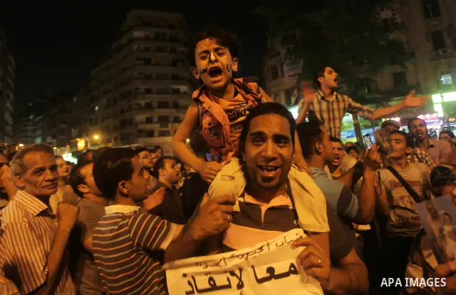 A youth takes part in a demonstration in Tahrir Square to protest the outcome of the Egyptian presidential election, Cairo, Egypt, Monday May 28, 2012. The runoff vote for Egypt's next president will pit the Muslim Broth...