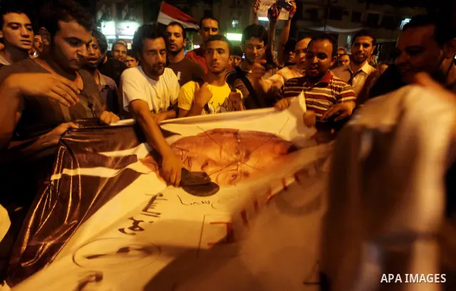 A youth takes part in a demonstration in Tahrir Square to protest the outcome of the Egyptian presidential election, Cairo, Egypt, Monday May 28, 2012. The runoff vote for Egypt's next president will pit the Muslim Broth...