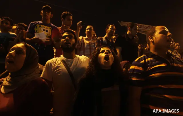 A youth takes part in a demonstration in Tahrir Square to protest the outcome of the Egyptian presidential election, Cairo, Egypt, Monday May 28, 2012. The runoff vote for Egypt's next president will pit the Muslim Broth...