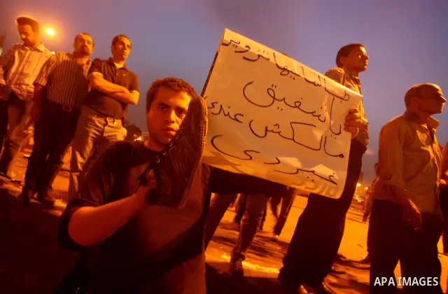 A youth takes part in a demonstration in Tahrir Square to protest the outcome of the Egyptian presidential election, Cairo, Egypt, Monday May 28, 2012. The runoff vote for Egypt's next president will pit the Muslim Broth...