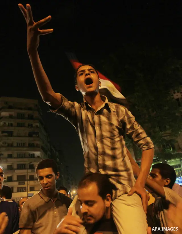 A youth takes part in a demonstration in Tahrir Square to protest the outcome of the Egyptian presidential election, Cairo, Egypt, Monday May 28, 2012. The runoff vote for Egypt's next president will pit the Muslim Broth...