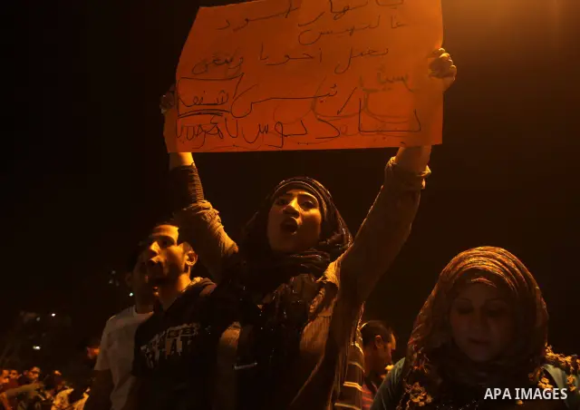A youth takes part in a demonstration in Tahrir Square to protest the outcome of the Egyptian presidential election, Cairo, Egypt, Monday May 28, 2012. The runoff vote for Egypt's next president will pit the Muslim Broth...