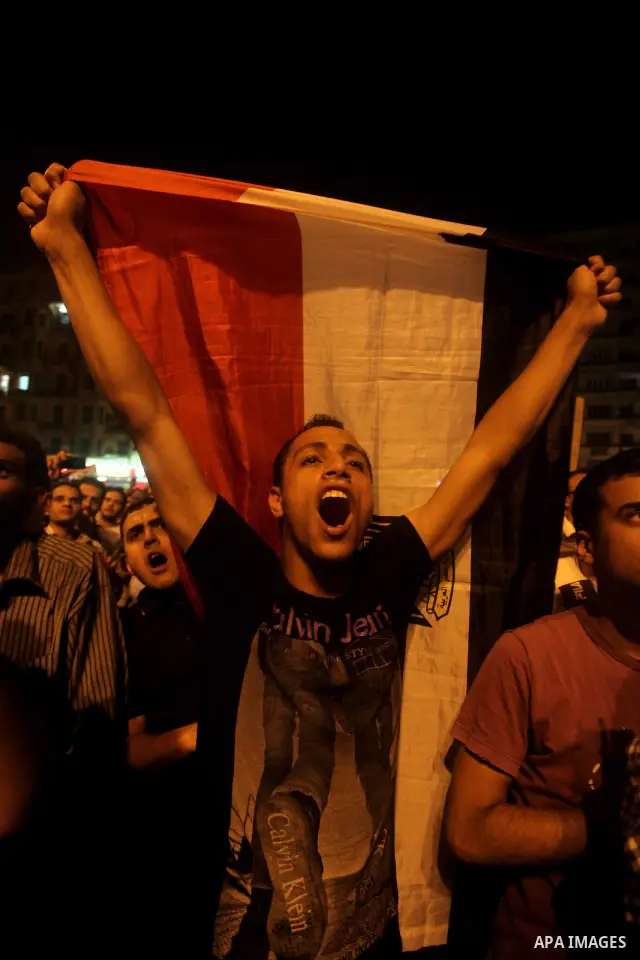 A youth takes part in a demonstration in Tahrir Square to protest the outcome of the Egyptian presidential election, Cairo, Egypt, Monday May 28, 2012. The runoff vote for Egypt's next president will pit the Muslim Broth...