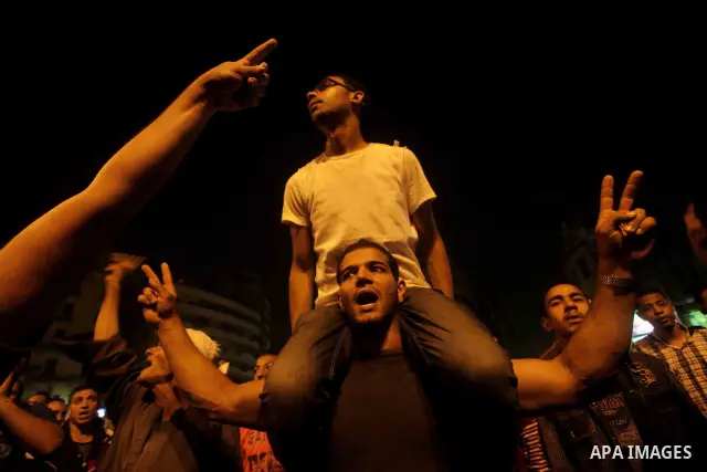 A youth takes part in a demonstration in Tahrir Square to protest the outcome of the Egyptian presidential election, Cairo, Egypt, Monday May 28, 2012. The runoff vote for Egypt's next president will pit the Muslim Broth...