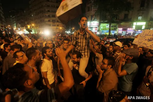 A youth takes part in a demonstration in Tahrir Square to protest the outcome of the Egyptian presidential election, Cairo, Egypt, Monday May 28, 2012. The runoff vote for Egypt's next president will pit the Muslim Broth...