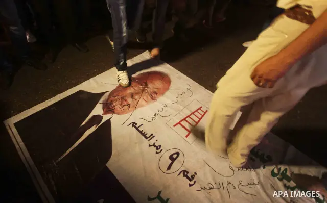 A youth takes part in a demonstration in Tahrir Square to protest the outcome of the Egyptian presidential election, Cairo, Egypt, Monday May 28, 2012. The runoff vote for Egypt's next president will pit the Muslim Broth...