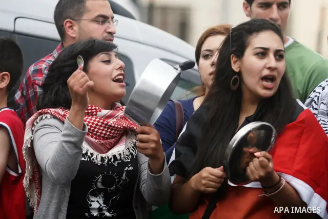 Palestinian protestors bang on pots covered in pictures of Palestinian prisoners Mahmoud al-Sarsak and Akram al-Rikhawi, who are still refusing food a week after a deal was made to end a mass prisoner hunger strike, duri...
