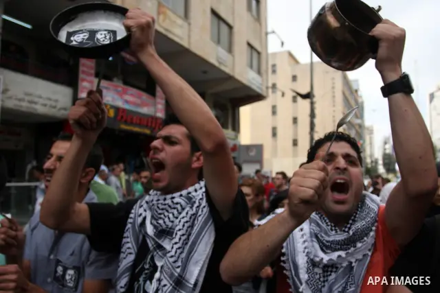 Palestinian protestors bang on pots covered in pictures of Palestinian prisoners Mahmoud al-Sarsak and Akram al-Rikhawi, who are still refusing food a week after a deal was made to end a mass prisoner hunger strike, duri...